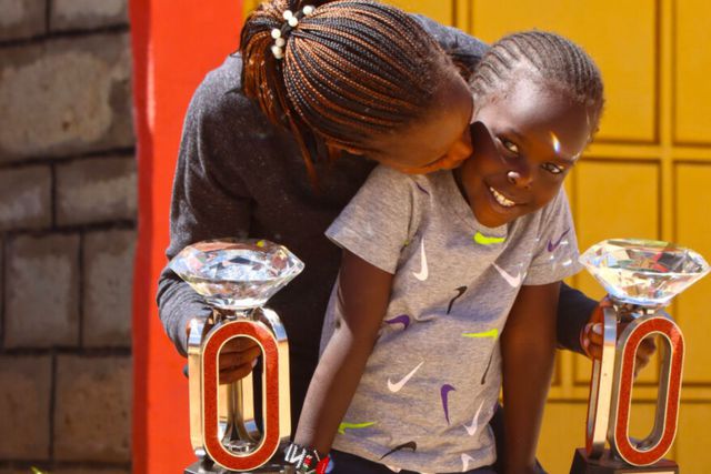 Faith Kipyegon and her daughter Alyne.