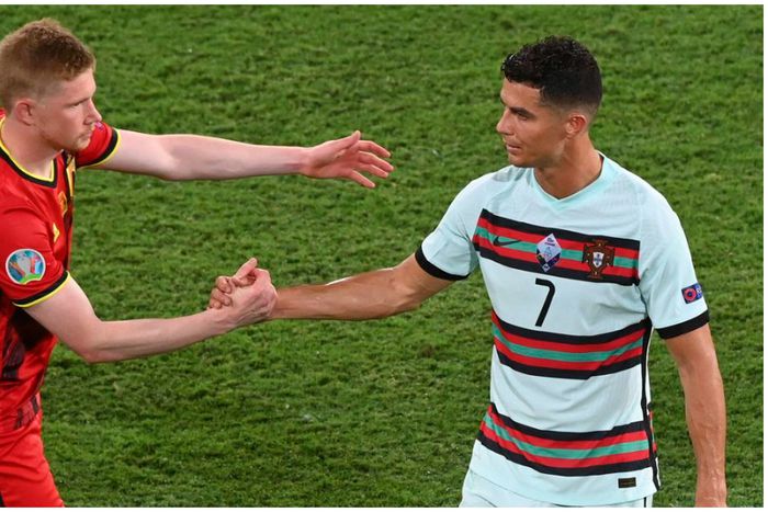 Kevin De Bruyne and Cristiano Ronaldo shake hands during a match between Belgium and Portugal.