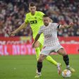 Gomez inspires Sevilla win to keep pressure on Real Madrid