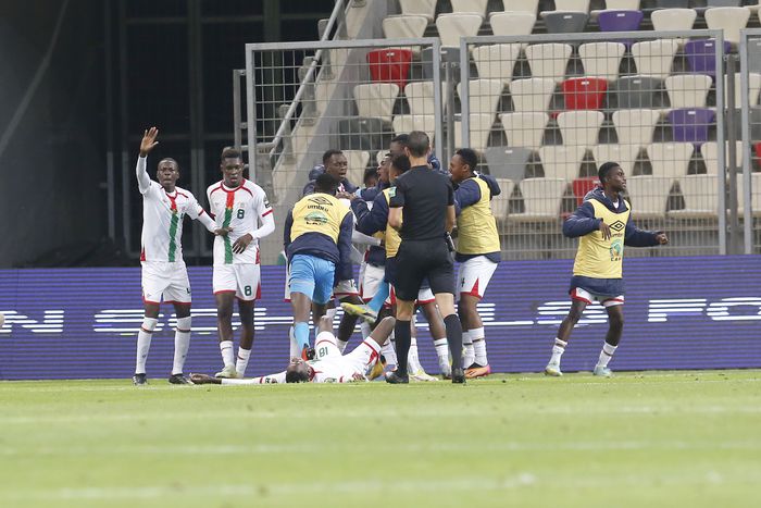 Burkina Faso players celebrate a hard-fought win over Nigeria.