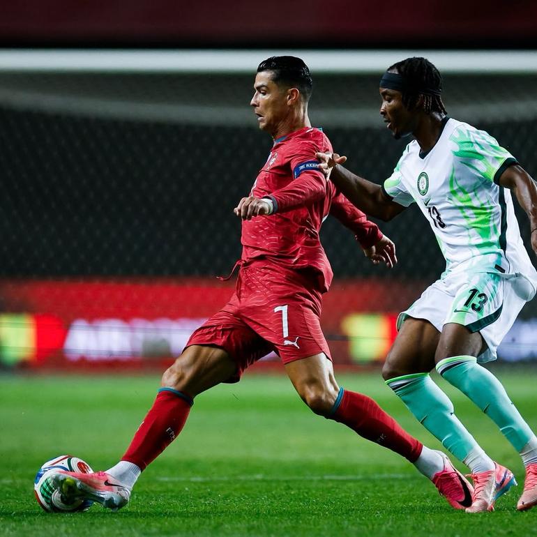 Ronaldo and Onyemaechi during the clash in Portugal