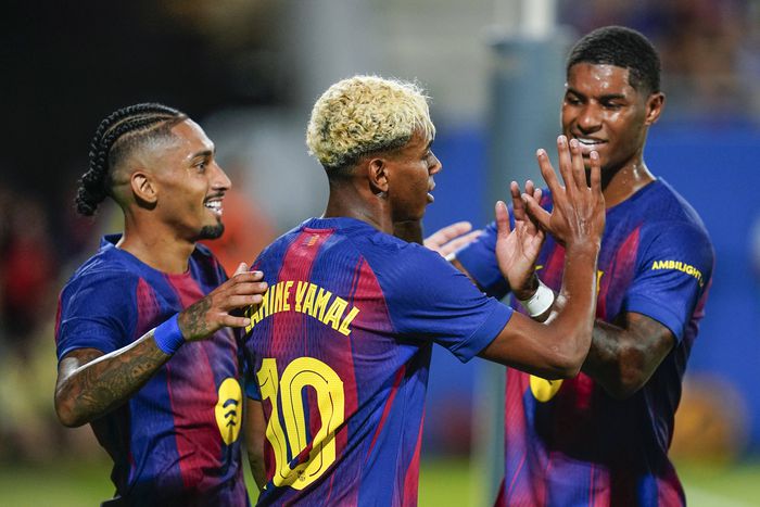 Lamine Yamal of FC Barcelona celebrates the 4-0 with Raphael Dias Belloli Raphinha and Marcus Rashford || Image credit: Imago