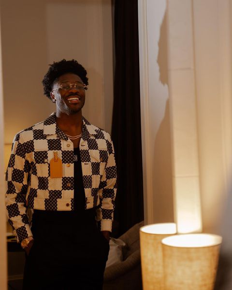 In the photos for his 27th birthday, Aina was wearing black shorts with a check jacket to go with shades. Instagram/Ola Aina