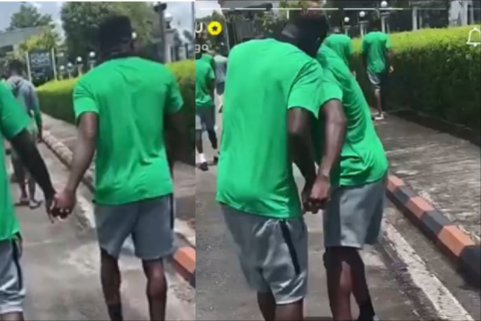 Ahead of the game between Nigeria and Libya, Super Eagles forward Victor Boniface and Taiwo Awoniyi hold hands.