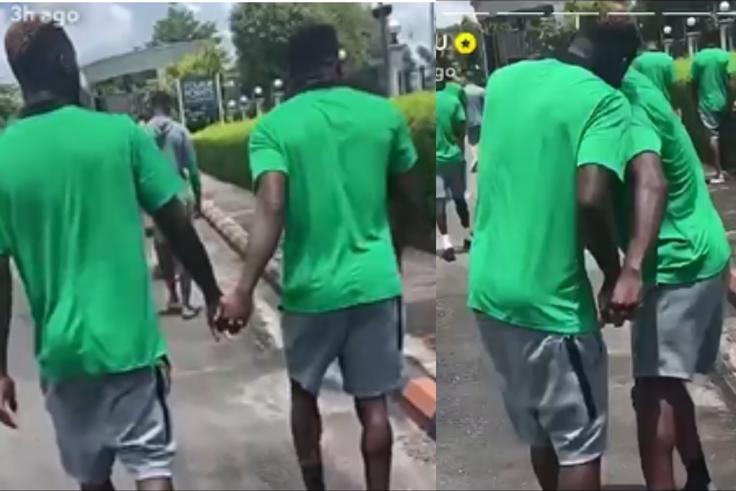 Ahead of the game between Nigeria and Libya, Super Eagles forward Victor Boniface and Taiwo Awoniyi hold hands.