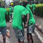 Ahead of the game between Nigeria and Libya, Super Eagles forward Victor Boniface and Taiwo Awoniyi hold hands.