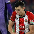 Anel Ahmedhodzic wearing normal armband instead of rainbow laces in Sheffield United vs Liverpool || Image credit: Imago