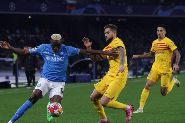 SSC Napoli v FC Barcelona, Barca Round of 16 First Leg - UEFA Champions League 2023/24 Victor Osimhen centre-forward of Napoli and Nigeria and Inigo Martinez centre-back of Barcelona and Spain compete for the ball || Image credit: Imago