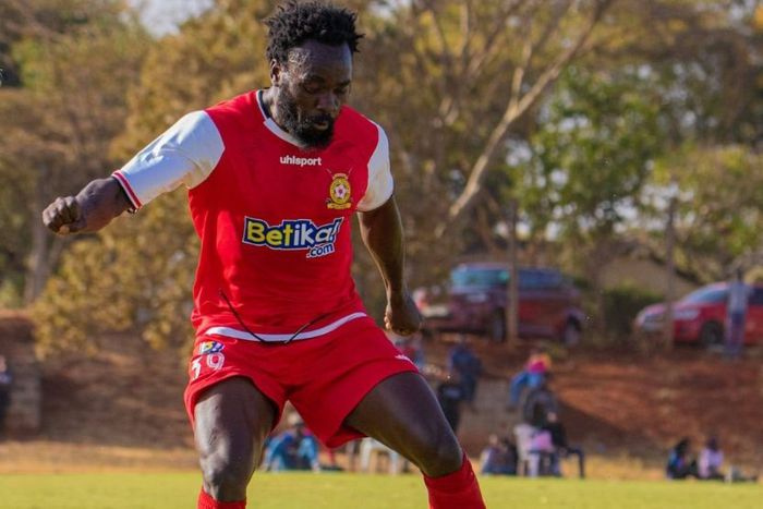 Kenya Police forward Elvis Rupia controls the ball.