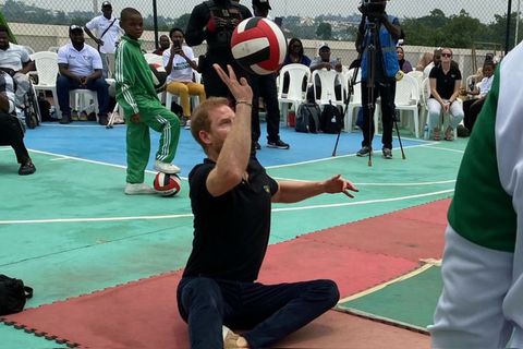 Prince Harry as you have never seen him: Duke of Sussex plays sit-down volleyball during Nigeria visit