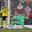 Reus strikes twice as Dortmund trim Bayern's lead