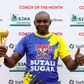 Butali Sugar Warriors Coach poses for a photo with his trophy