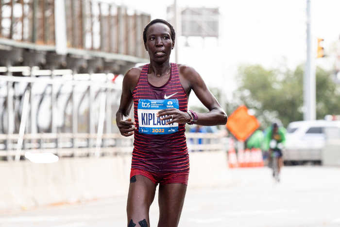 , New York City, United States: Edna Kiplagat (KEN) entering Harlem from the Bronx via the Madison Avenue Bridge during the 2022 TCS New York City Marathon.