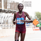 , New York City, United States: Edna Kiplagat (KEN) entering Harlem from the Bronx via the Madison Avenue Bridge during the 2022 TCS New York City Marathon.
