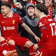 MO Salah celebrates with his Liverpool teammates.