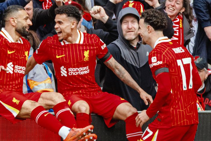 MO Salah celebrates with his Liverpool teammates.