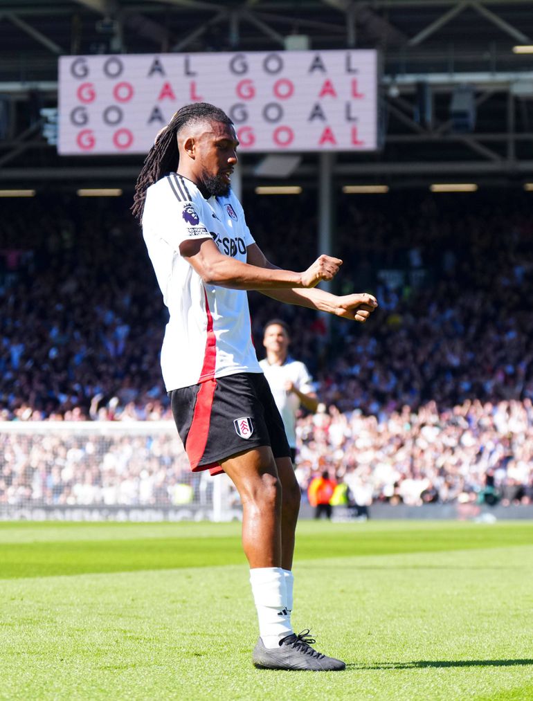 Alex Iwobi celebrates scoring for Fulham against Liverpool