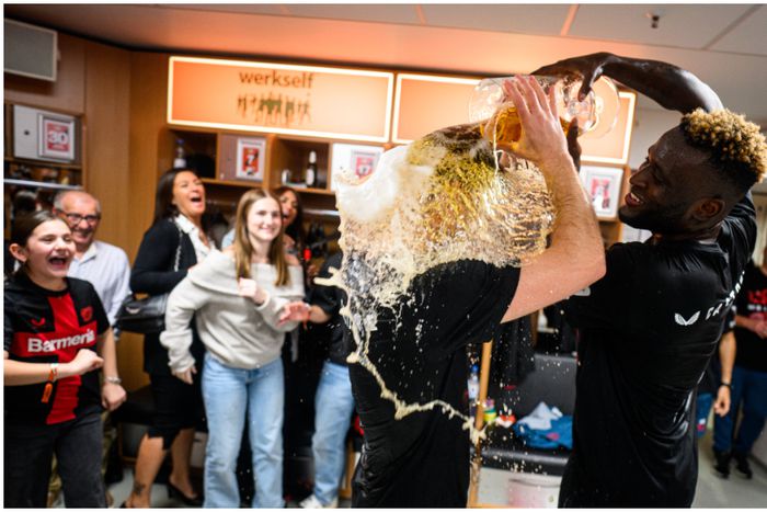 Victor Boniface and his Bayer Leverkusen teammates enjoy their title celebrations with beer.