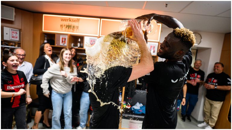 Victor Boniface and his Bayer Leverkusen teammates enjoy their title celebrations with beer.