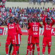 Simba SC players applaud fans.