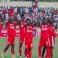 Simba SC players applaud fans.
