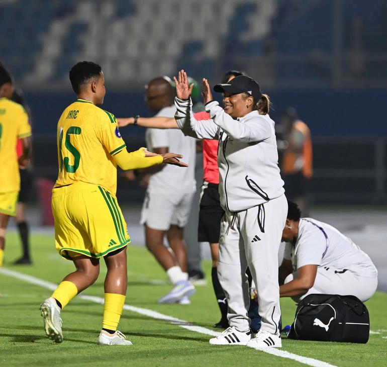 Refiloe Jane celebrates with her South African coach.