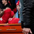 Lisandro Martinez of Manchester United leaves Old Trafford injured.