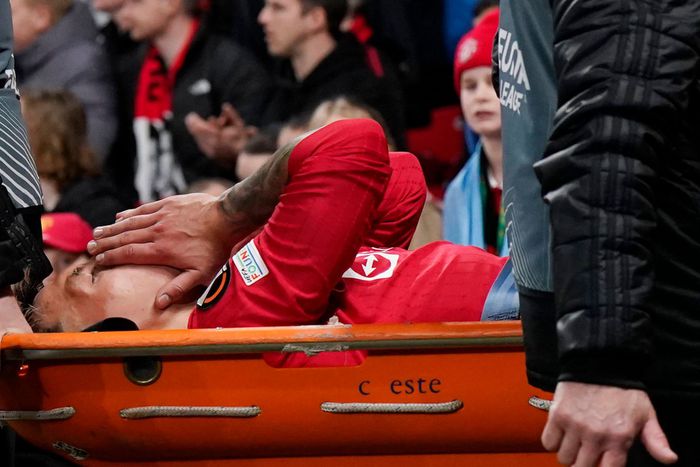 Lisandro Martinez of Manchester United leaves Old Trafford injured.