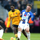 Wolverhampton Wanderers Boubacar Traore (centre) battle for the ball with Brighton and Hove Albion s Moises Caicedo (left) and Alexis Mac Allister