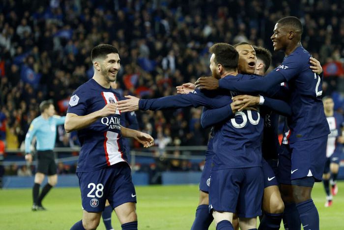 Lionel Messi celebrates with teammates after scoring for PSG against Lens