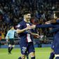 Lionel Messi celebrates with teammates after scoring for PSG against Lens