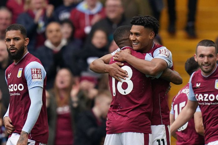Aston Villa's Ollie Watkins and Ashley Young celebrating a goal.