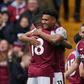 Aston Villa's Ollie Watkins and Ashley Young celebrating a goal.
