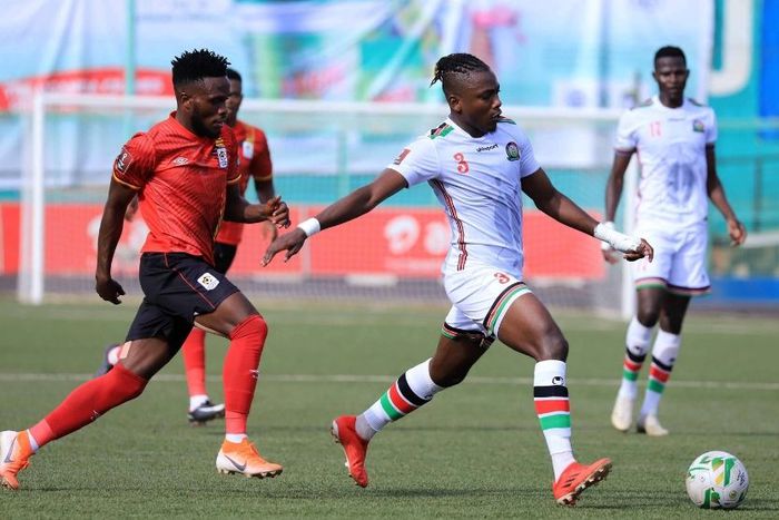 Steven Mukwala (front, L) of Uganda vies with Omar Khamis (front, R) of Kenya.