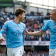 Erling Haaland and John Stones celebrate a Manchester City goal.