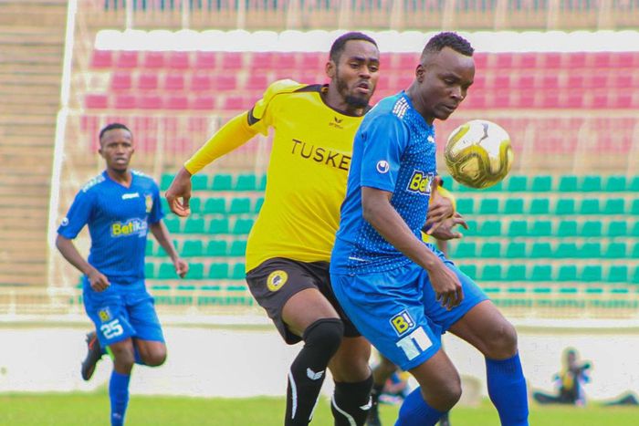 Derrick Otanga shielding the ball from Daniel Sakari.