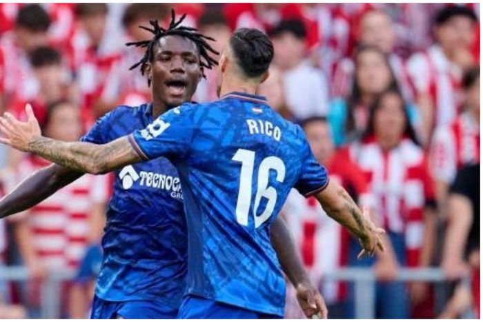 Chrisantus Uche celebrates his goal with Getafe teammate Rico.