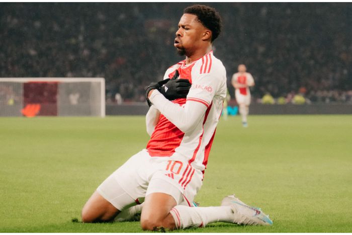 Ajax hero Chuba Akpom celebrates against Athens.