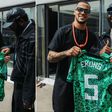 Vice-captain Ekong gifts Nigerian rapper Odumodublvck a Super Eagles jersey.