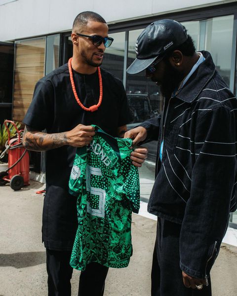 Vice-captain Ekong gifts Nigerian rapper Odumodublvck a Super Eagles jersey.