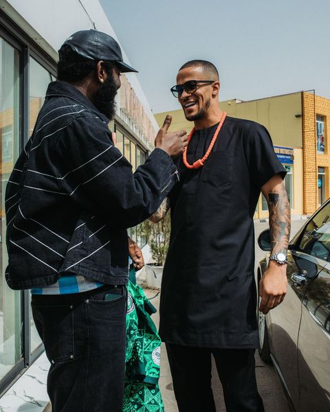 Vice-captain Ekong gifts Nigerian rapper Odumodublvck a Super Eagles jersey.