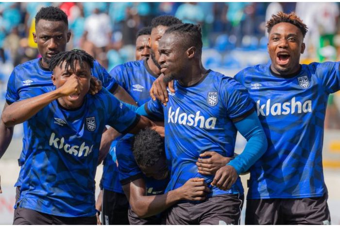 Junior Lokosa leads celebrations for Sporting Lagos.