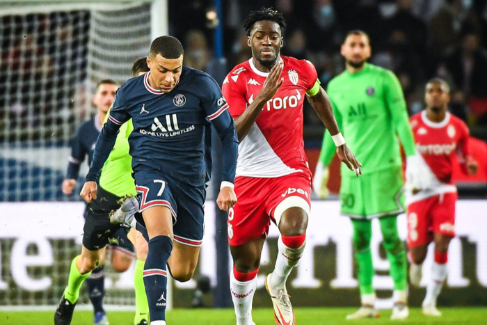 Axel Disasi chasing down Kylian Mbappe