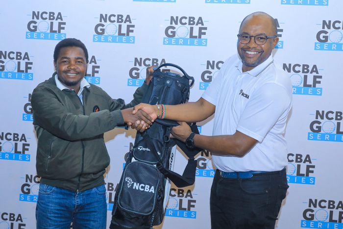 Peter Muchangi (L) being awarded after emerging overall winner