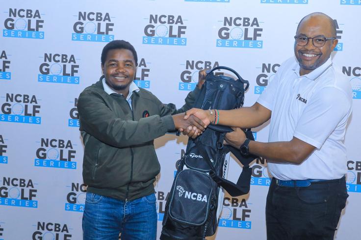 Peter Muchangi (L) being awarded after emerging overall winner