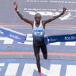 Evans Chebet cuts the tape at the 2022 New York City Marathon