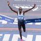 Evans Chebet cuts the tape at the 2022 New York City Marathon
