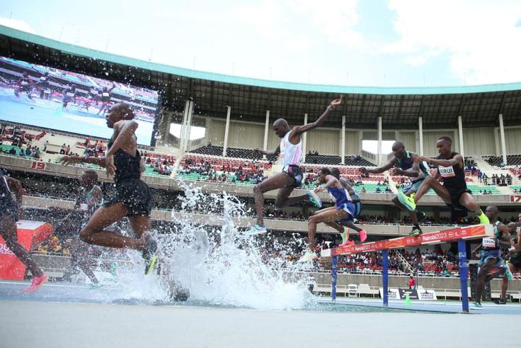 Amos Kirui jumps a barrier (far left) during the Kip Keino Classic