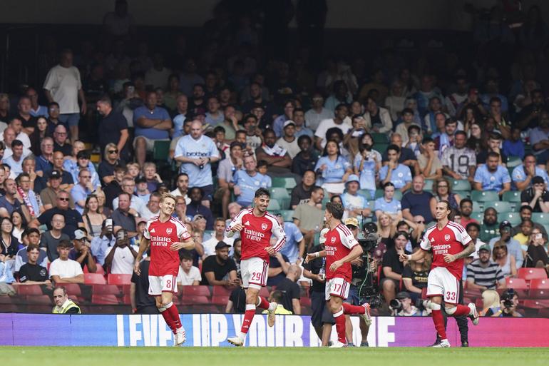 Arsenal players celebrating after scoring || Imago