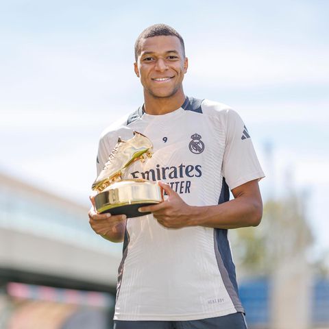Real Madrid stars Kylian Mbappe, Jude Bellingham and Vinicius Junior celebrate Champions League awards.